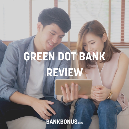 couple reading a green dot bank review on a tablet