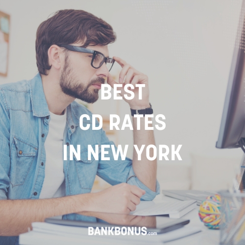 man searching on the computer for the best cd rates in new york